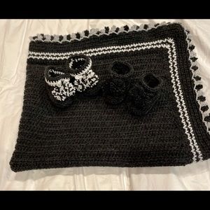 A beautiful hand crochet baby afghan.  Charcoal